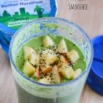 a green smoothie with apple chunks and chia seeds