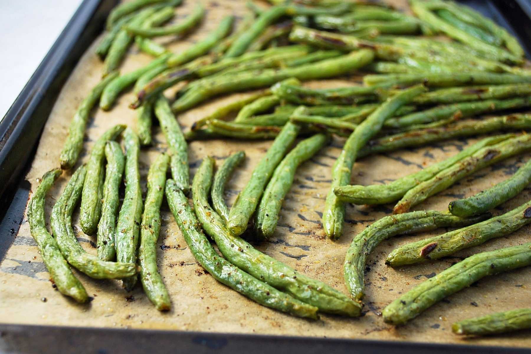 green beans roasted on a baking sheet.