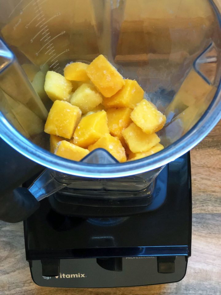 frozen fruit in a Vitamix container