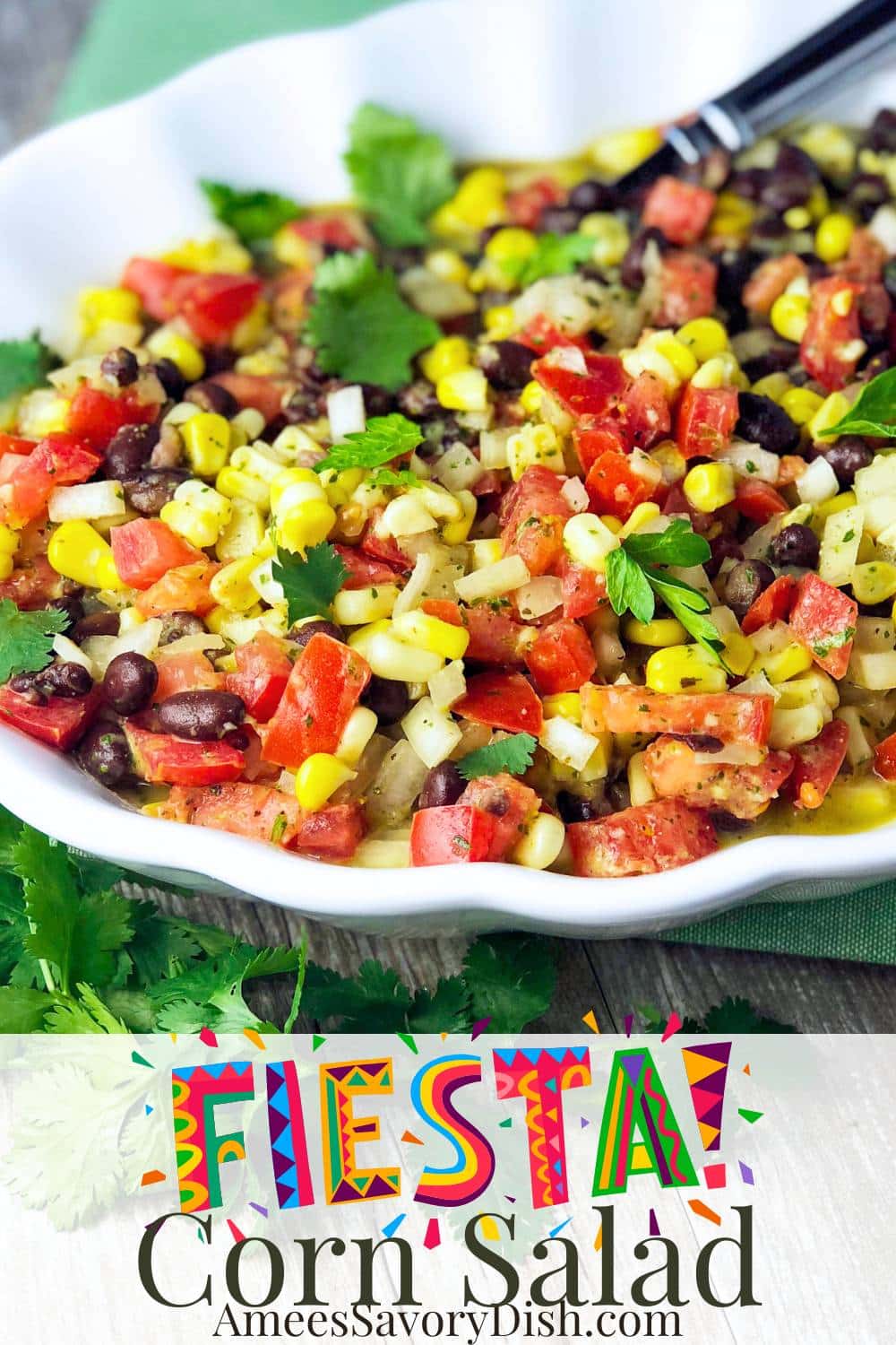 This easy Fiesta Salad features a refreshing medley of corn, black bean, and fresh veggies tossed in an irresistible Mojo-inspired sweet honey lime dressing. via @Ameessavorydish
