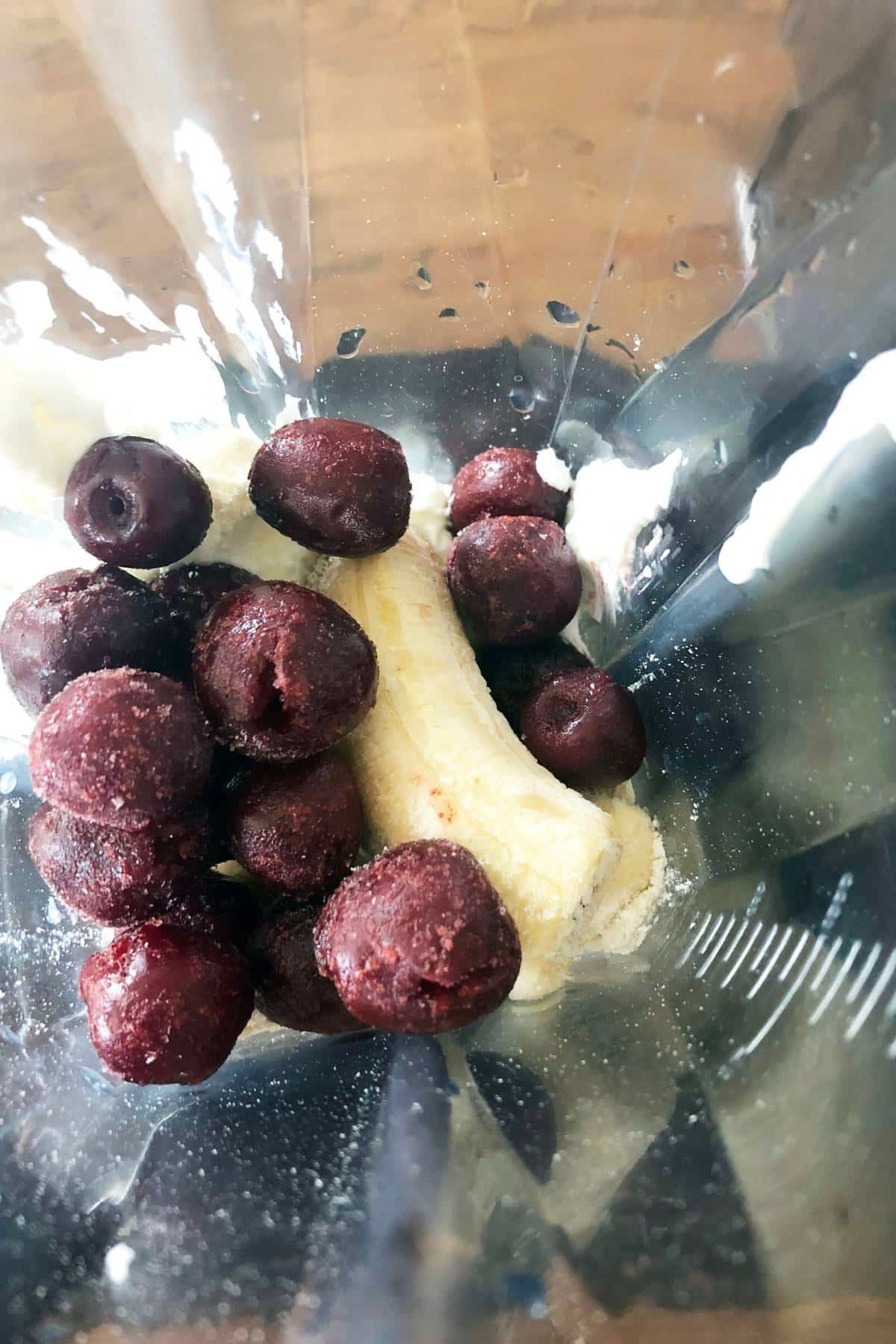 cherry smoothie bowl ingredients in a blender container