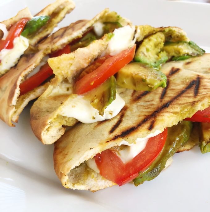 Close up of sliced Caprese pitas on a platter