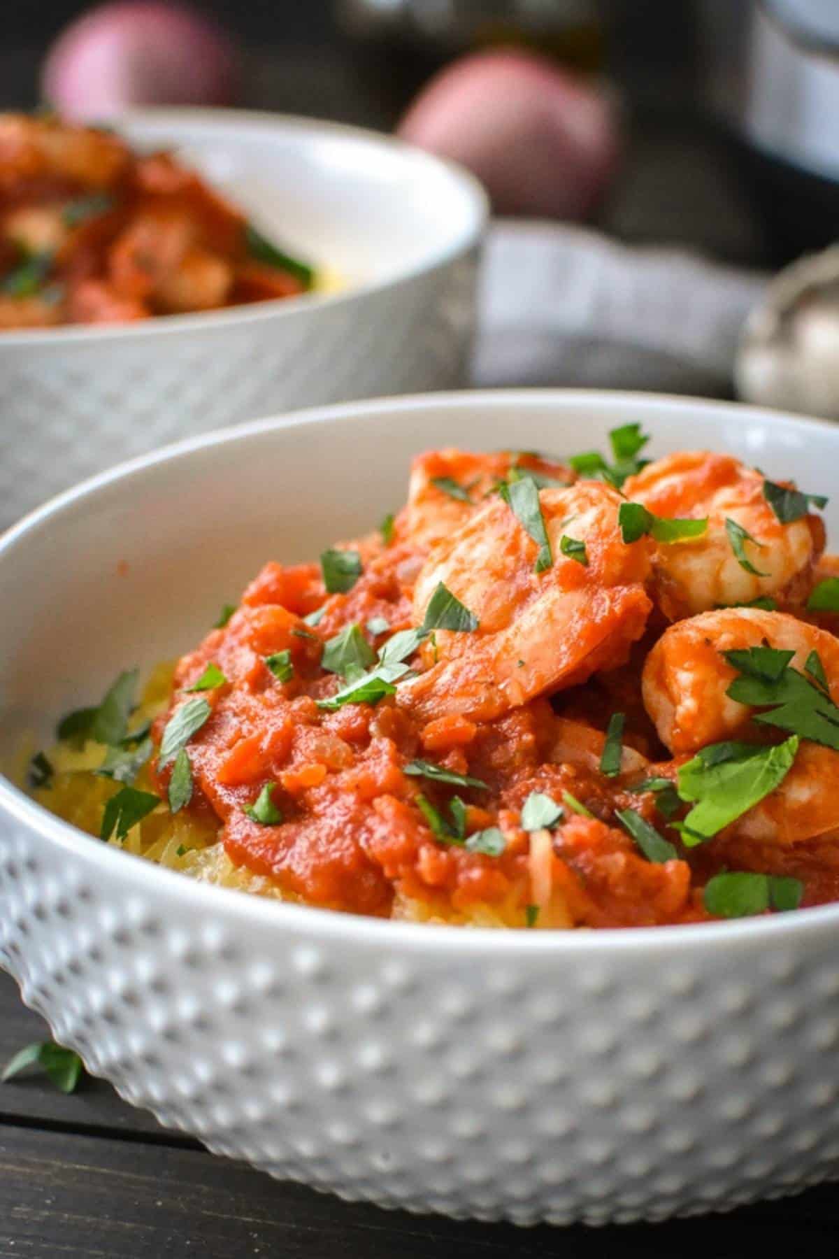shrimp over spaghetti squash in a bowl