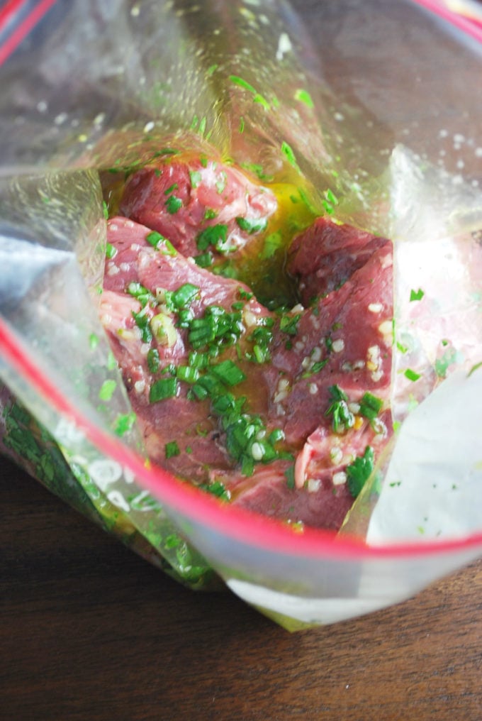 flat iron steak in a zip-top bag with marinade