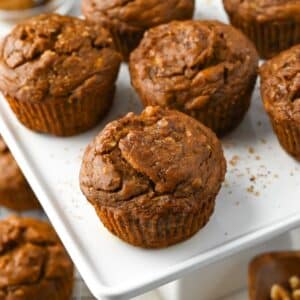 close up of muffins on a white platter