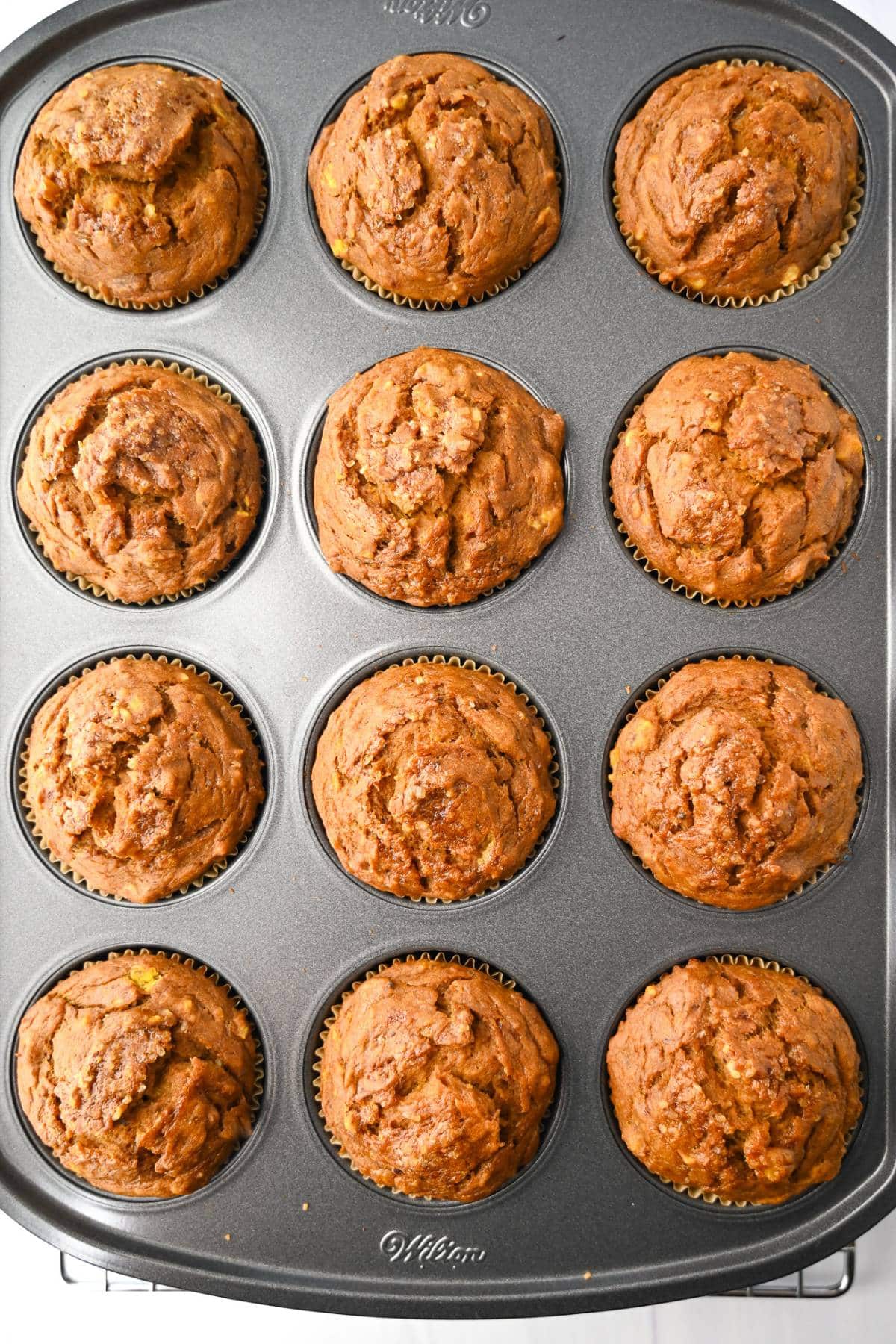 baked eggless banana muffins in a muffin tin