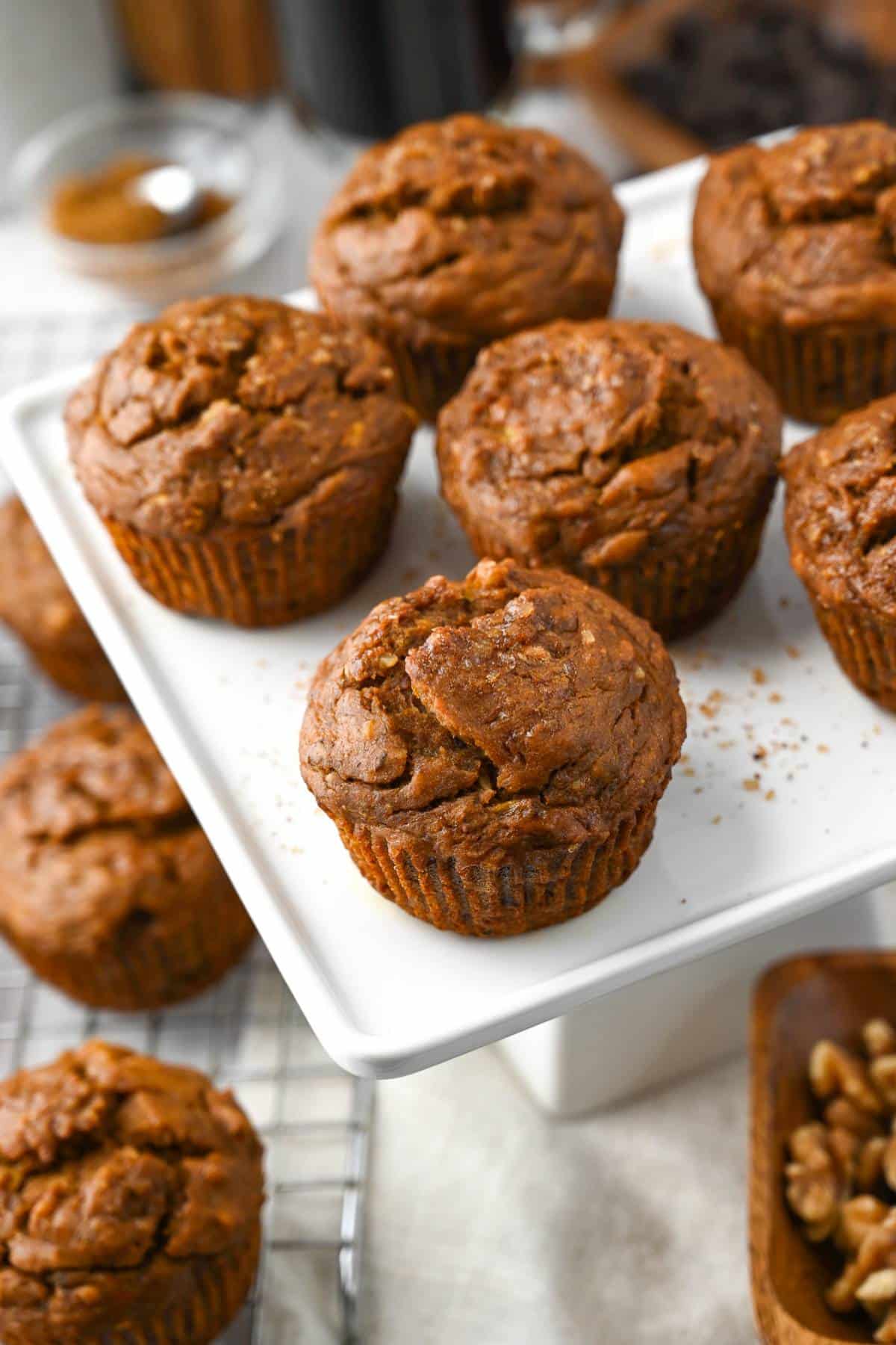 a platter of eggless banana muffins with nuts and a cup of coffee 
