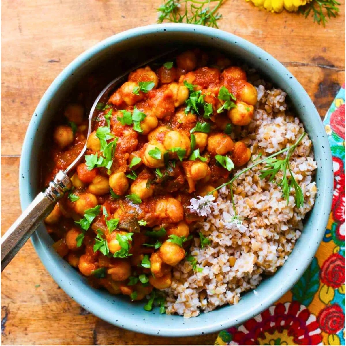 Instant pot chickpea curry in a bowl with a spoon