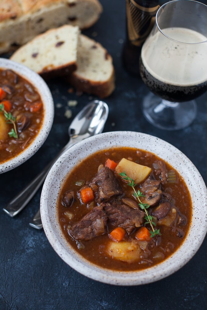 Guinness beef stew in bowls with spoons