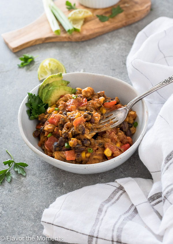 Pumpkin chili mac in a bowl with a fork