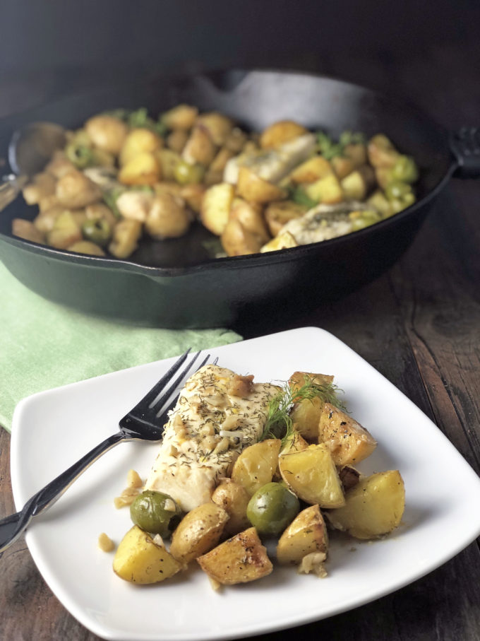 Baked Halibut with Fingerlings and Olives is a mouthwatering one-dish meal made with gold fingerling potatoes, green olives, halibut and dill.