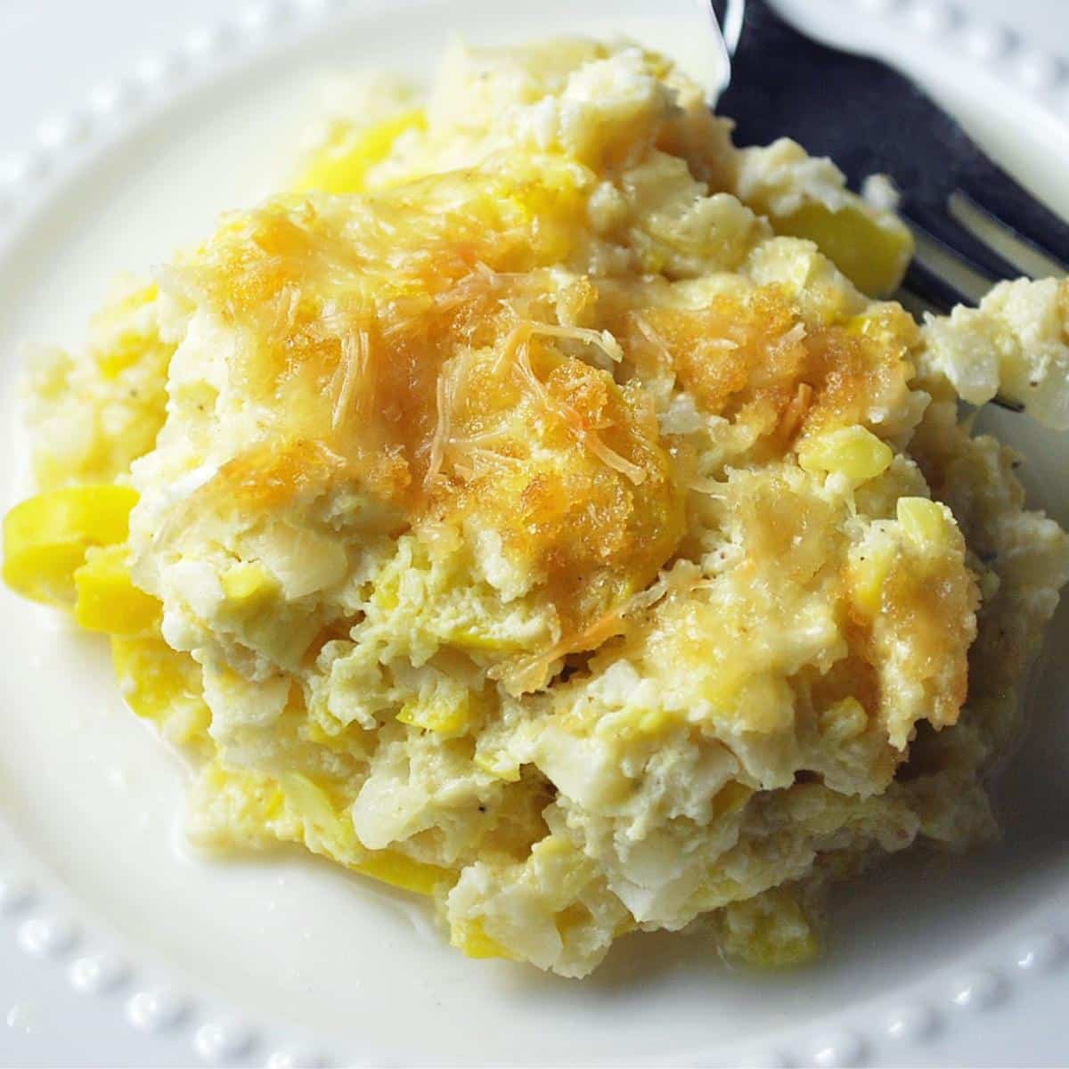 close up of squash casserole made with riced cauliflower on a plate