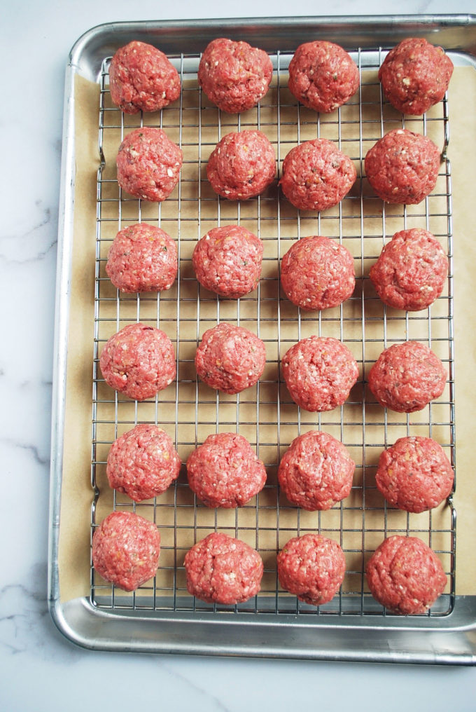 Meatballs on a baking sheet ready to cook