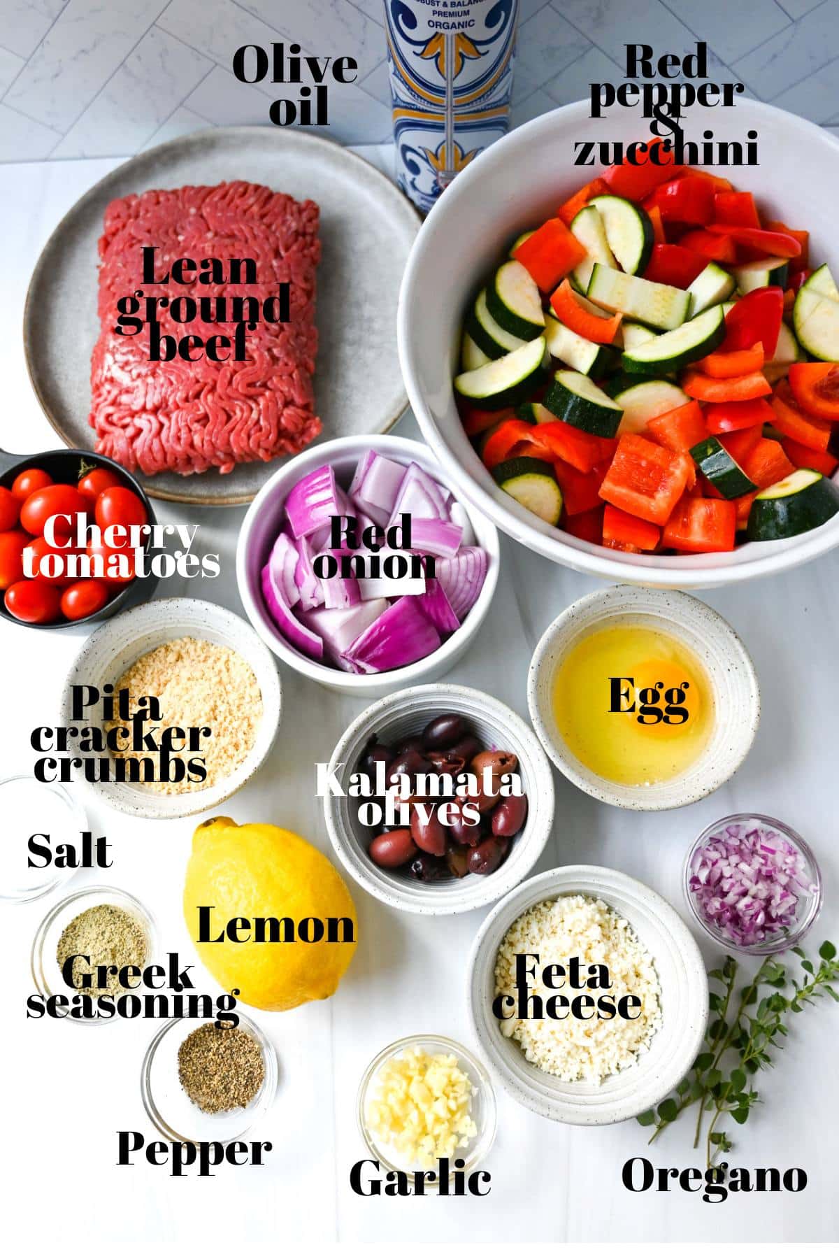 ingredients to make greek meatballs and vegetables measured out on a counter