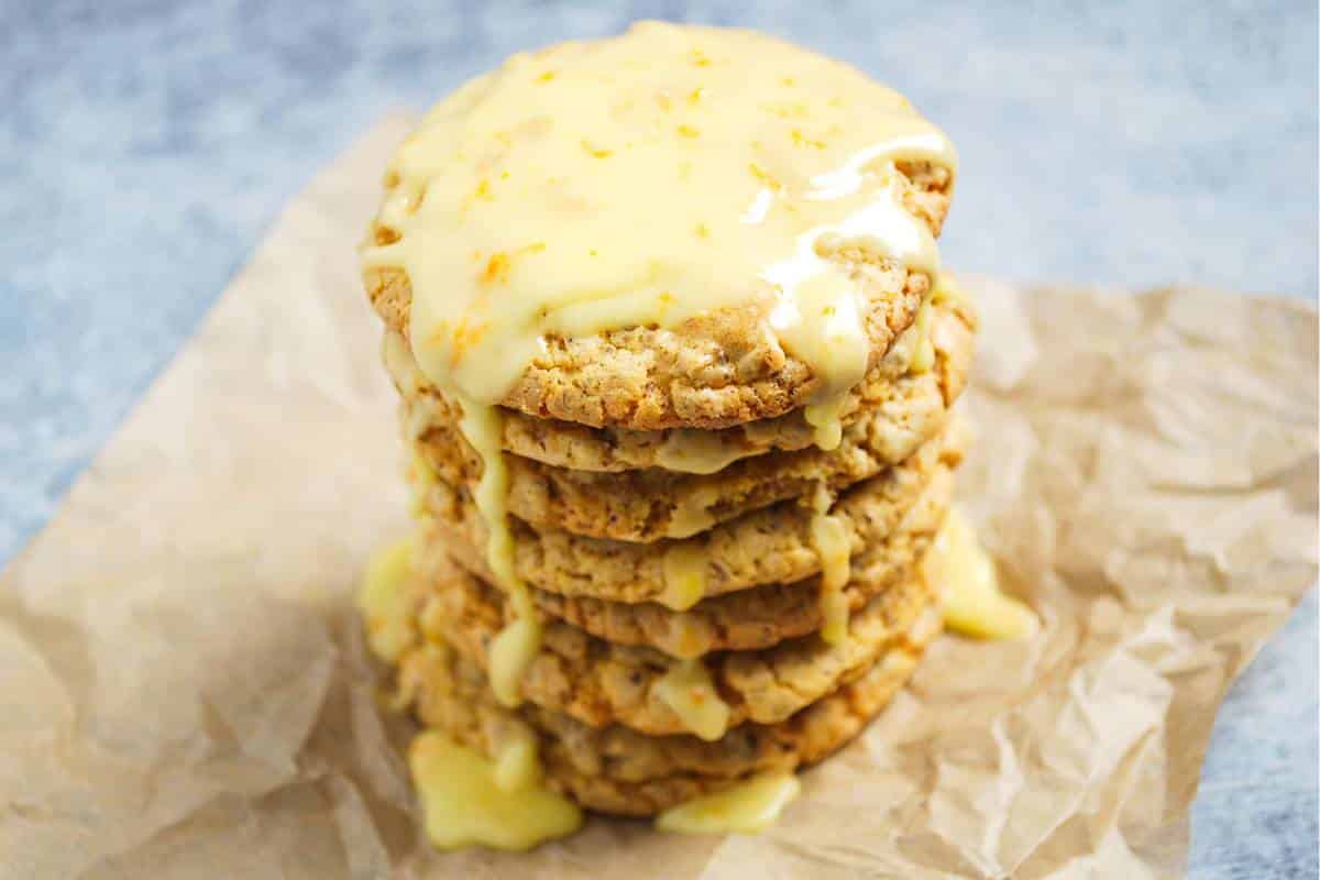 a stack of cookies on a sheet of wrinkled parchment paper