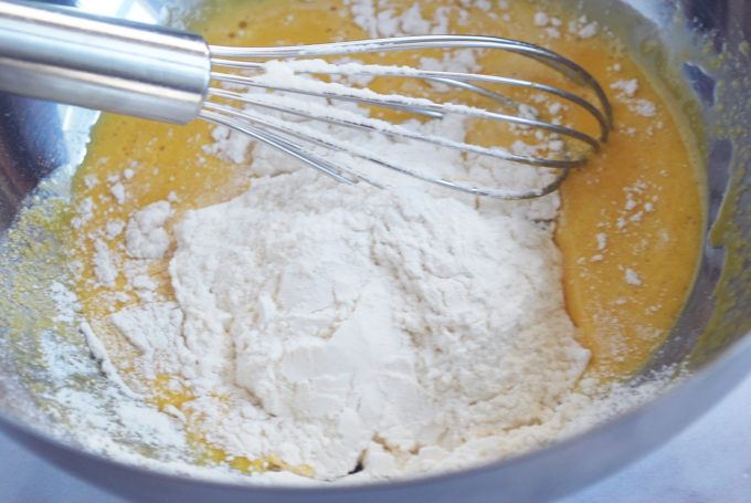 mixing flour into the egg yolk mixture for Japanese pancakes