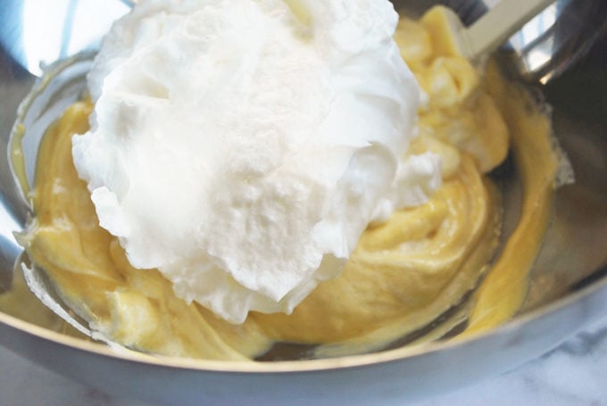 folding meringue into the egg yolk mixture for Japanese pancakes