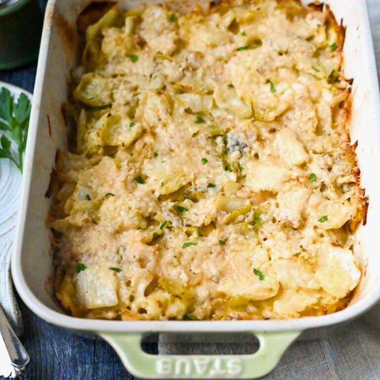 looking down at a pan of baked cabbage casserole with melted parmesan on top