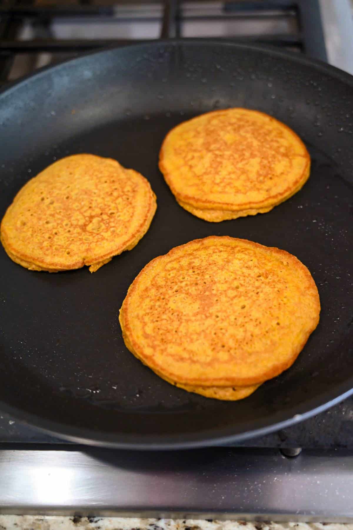 cooked pumpkin pancakes in a skillet