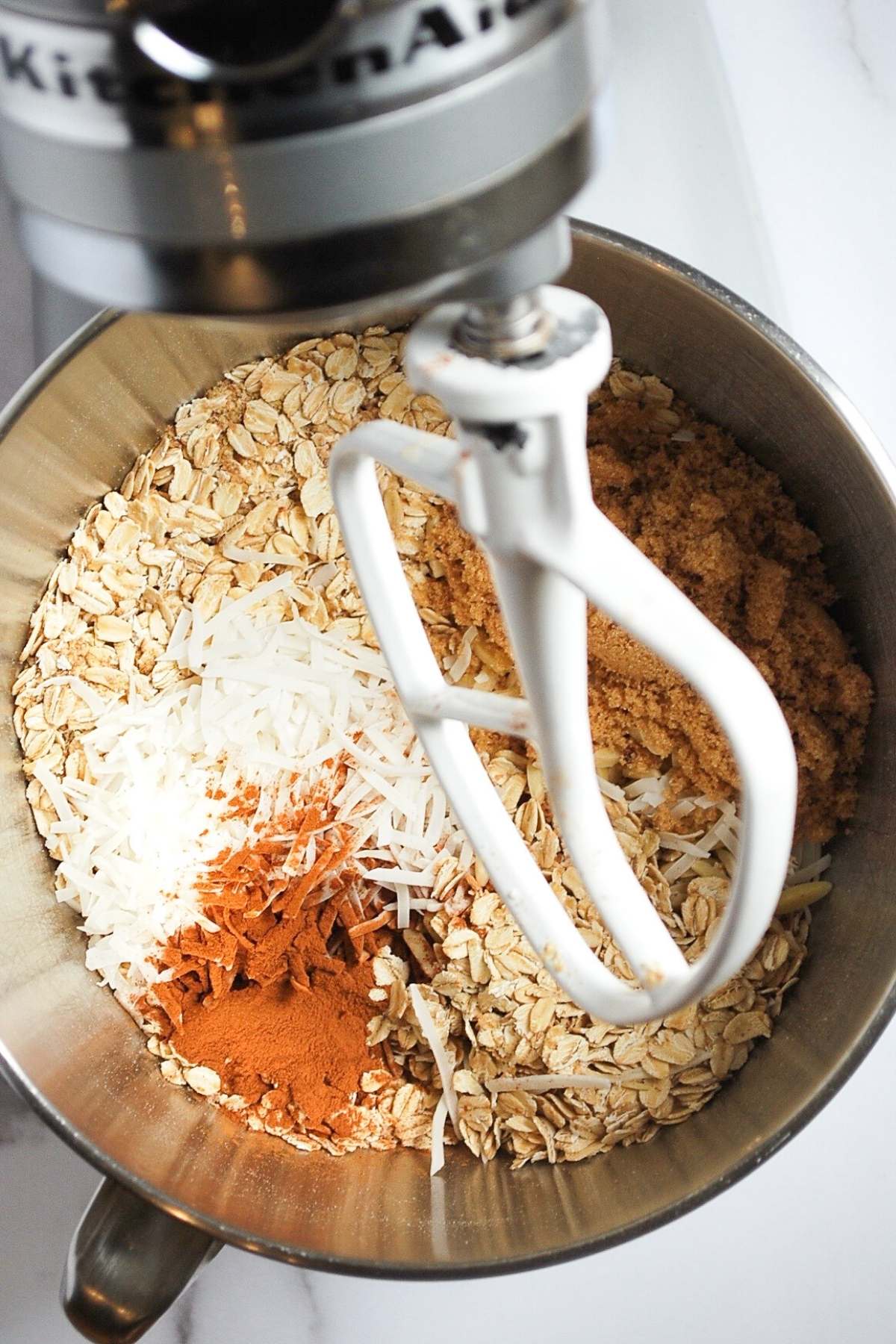 dry ingredients for granola in a stand mixer