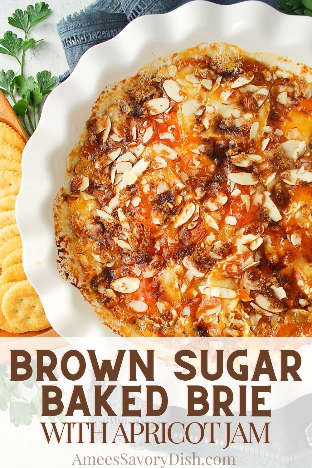 Brown Sugar Baked Brie -a rich and decadent blend of buttery brioche, tangy brie cheese, apricot jam, almonds, and brown sugar. This easy appetizer comes together quickly and is sure to impress your guests this holiday season. via @Ameessavorydish