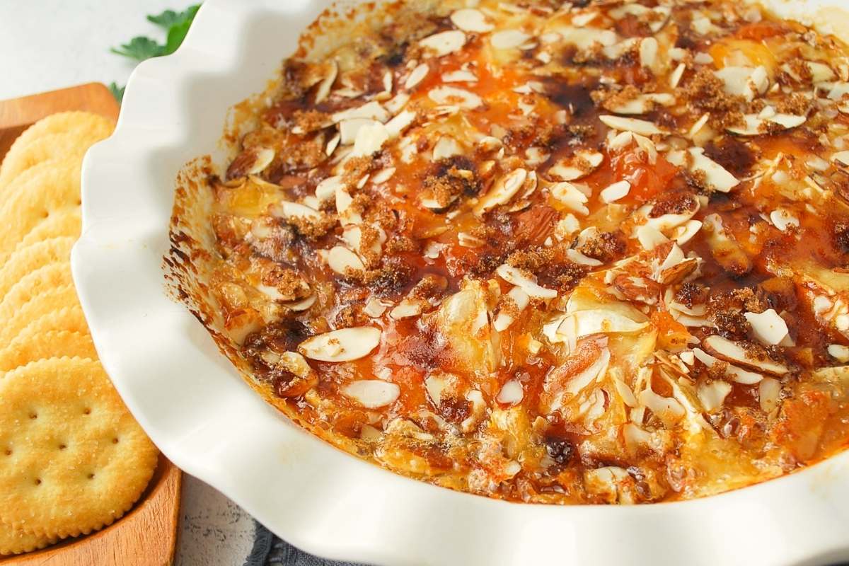 close up photo of brown sugar baked brie in a pie dish