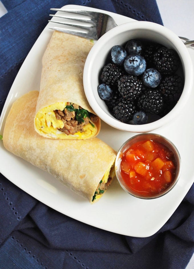 breakfast burritos for meal prep with fresh berries and salsa