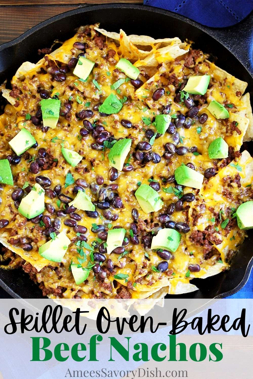 An easy and delicious oven-baked skillet nachos recipe made with tortilla chips, black beans, seasoned ground beef, and shredded cheese baked in a cast-iron skillet.  via @Ameessavorydish