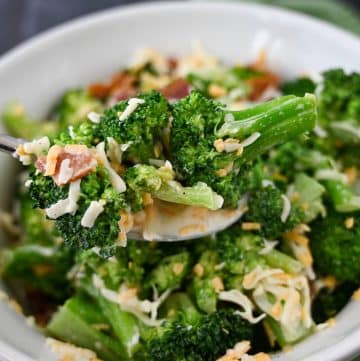close up of a spoonful of broccoli salad