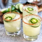 skinny spicy margaritas garnished with fresh jalapenos, lime, and a spicy salted rim