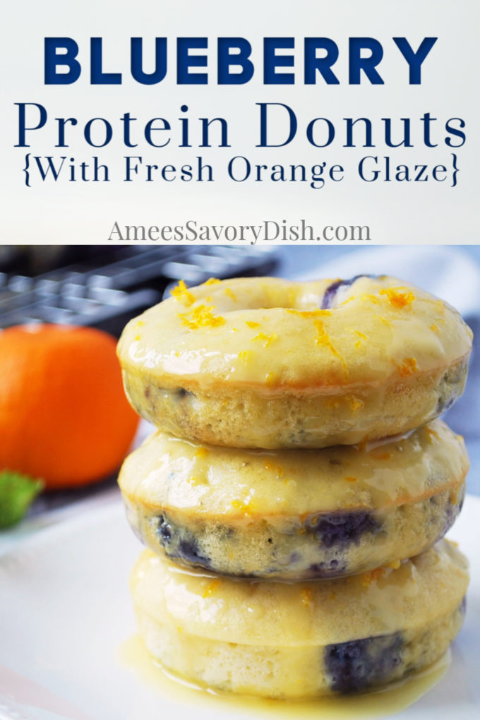 stack of 3 blueberry protein donuts dripping with orange glaze