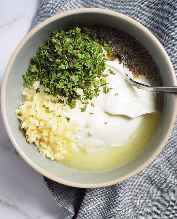 yogurt sauce ingredients for kofta wraps in a bowl