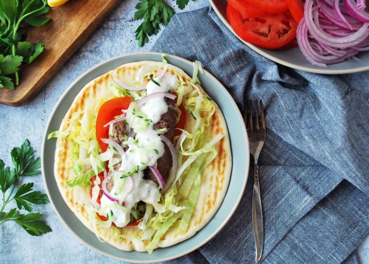 kofta wrap on a plate with fork