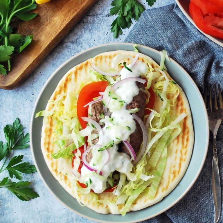 air fryer kofta on a Greek flatbread with all the toppings