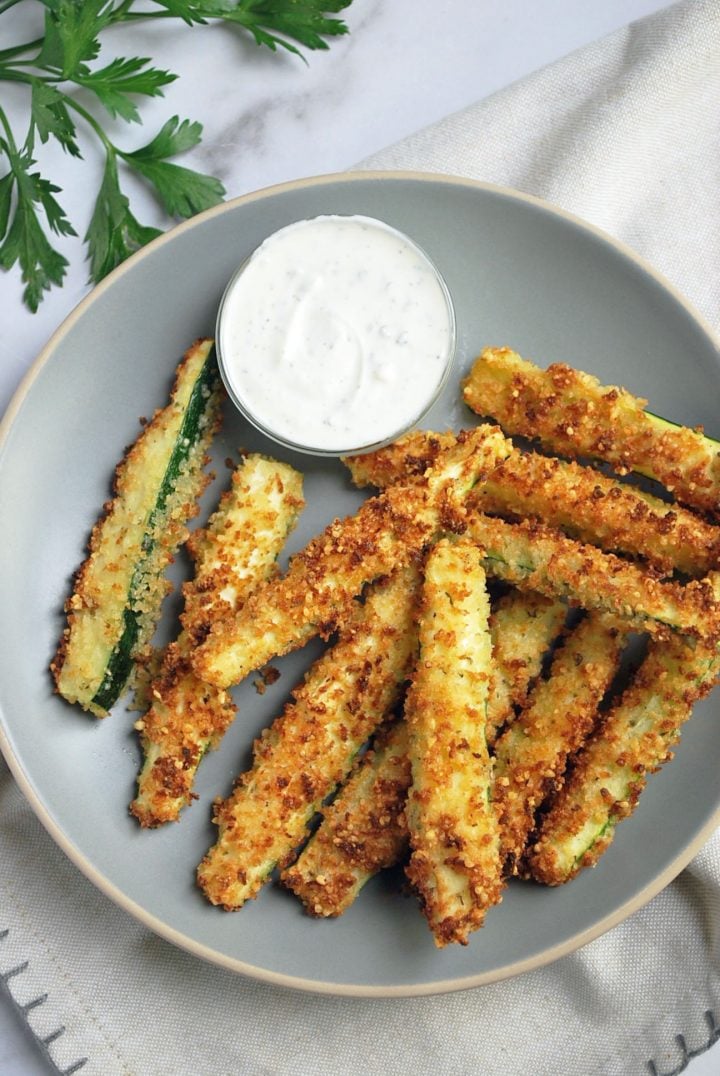 overhead shot of Air fryer zucchini fries on a plate