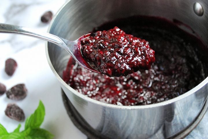 close up photo of a spoonful of blackberry compote 