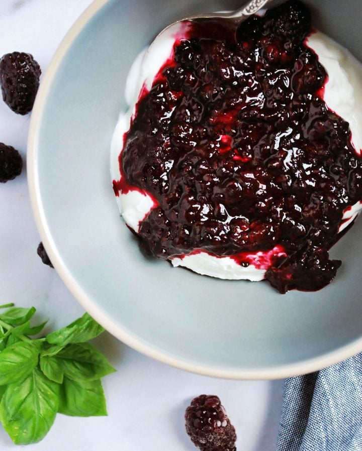 yogurt with blackberry compote drizzled on top