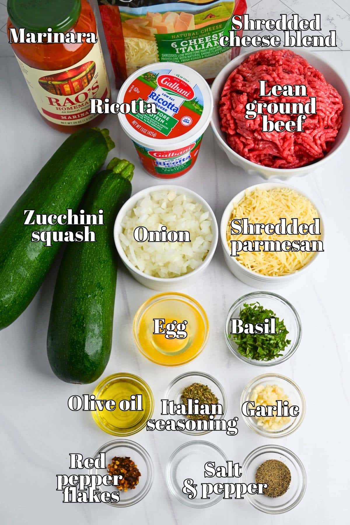 ingredients to make zucchini lasagna on a counter