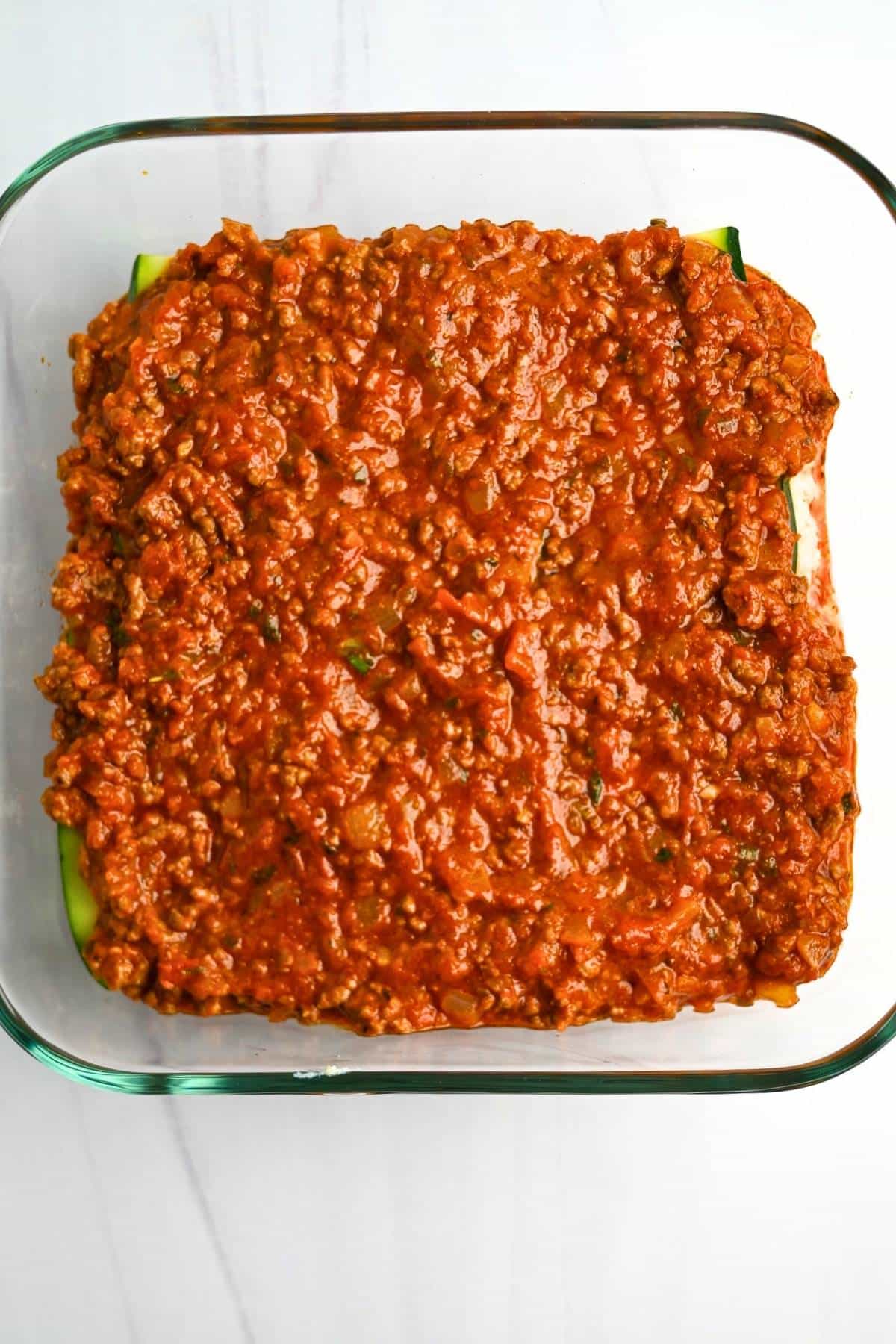 meat sauce layer in a baking dish
