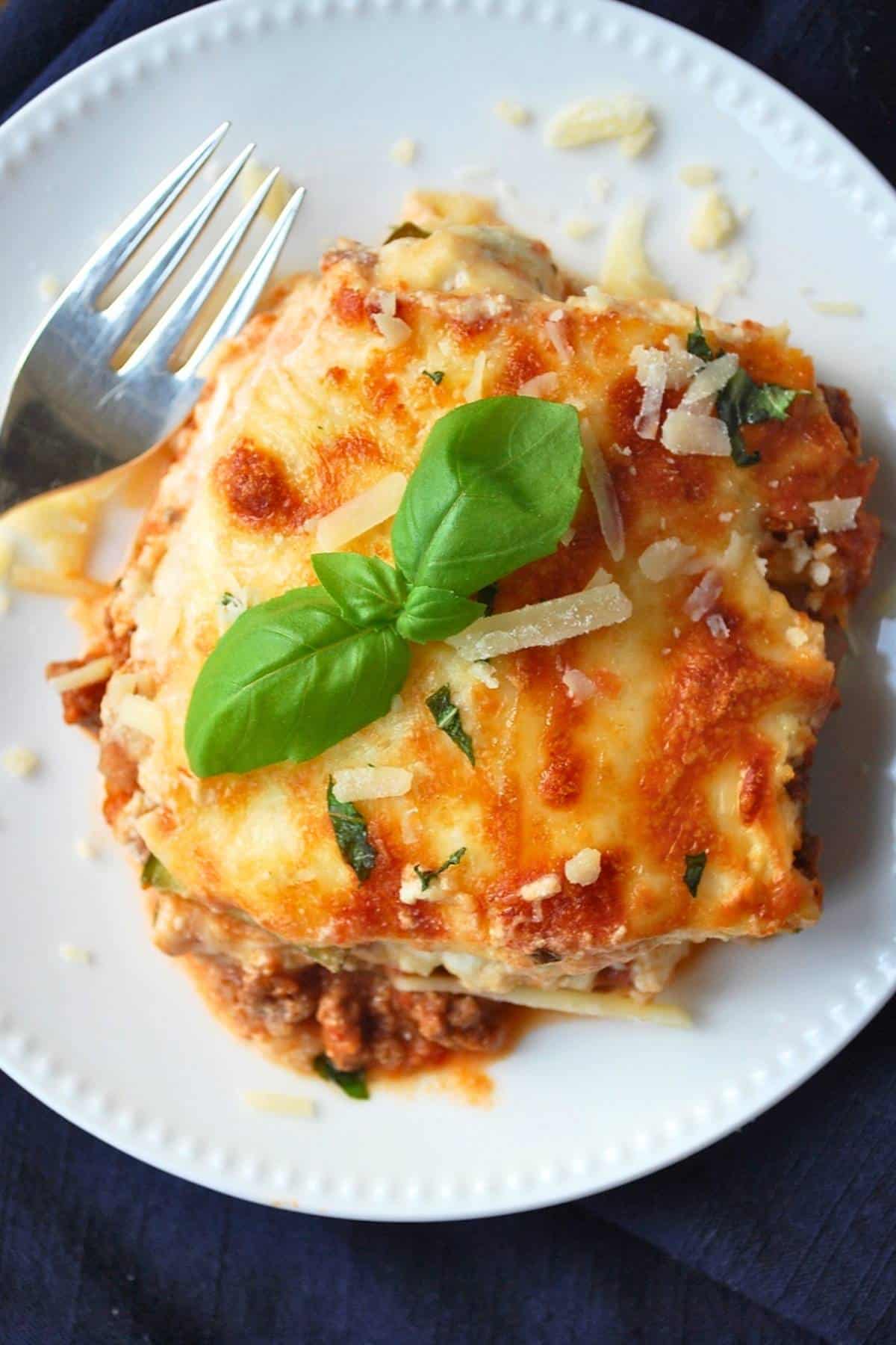 looking down at a slice of meaty low-carb lasagna made with zucchini