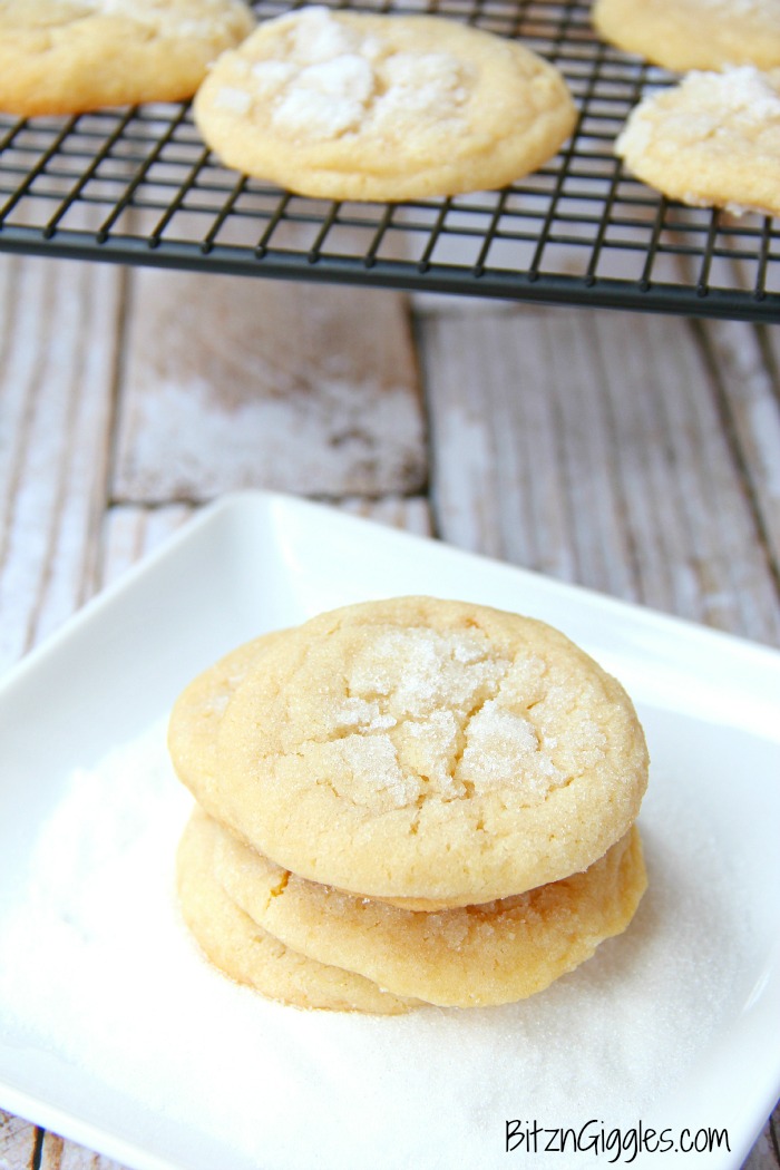 angel cookies stacked with cookies in the background