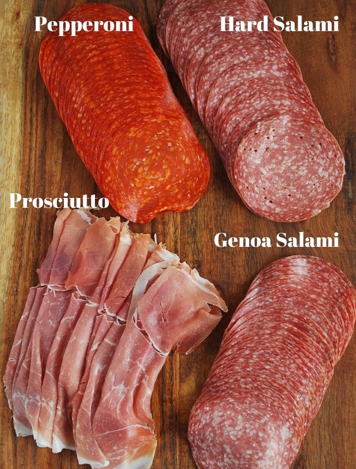 4 different Italian meats on a cutting board