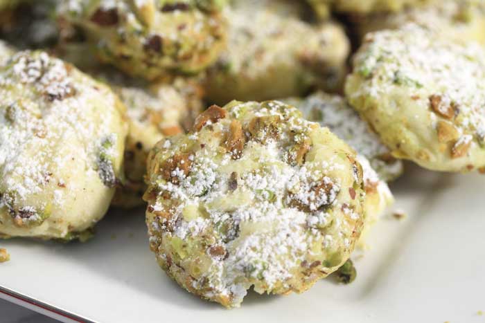 pistachio whipped shortbread cookies on a plate