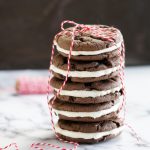 homemade oreos stacked with a ribbon tied around them