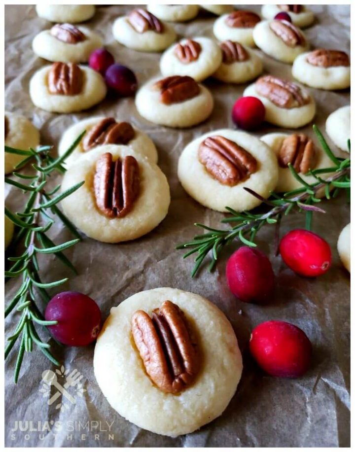 shortbread cookies with pecans on parchment paper