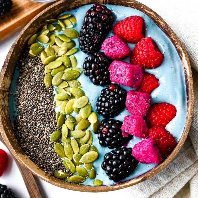 a bright blue smoothie bowl with colorful toppings