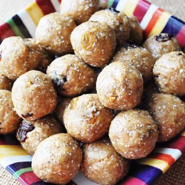 energy balls made with peanut butter and dried fruit on a colorful platter