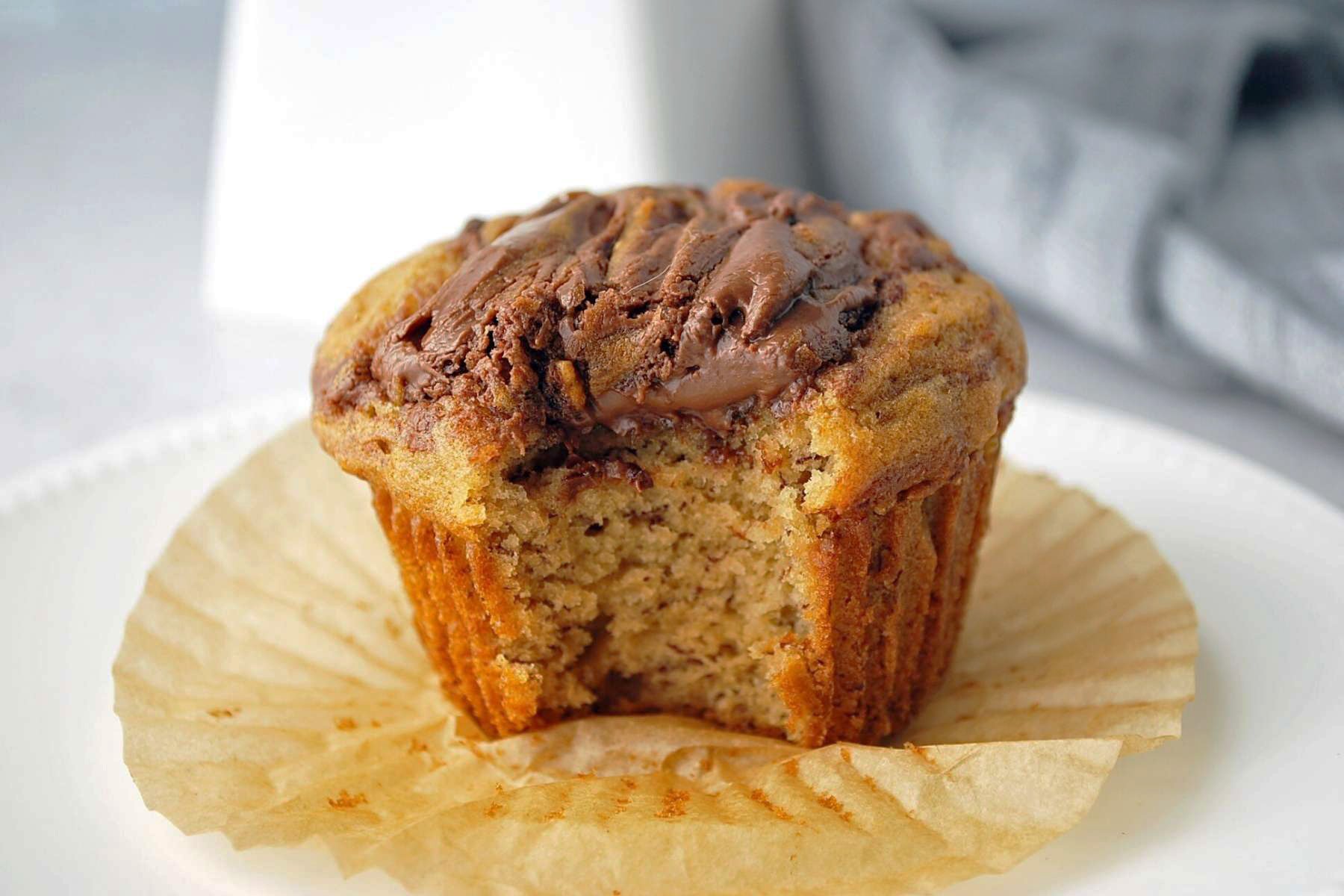 muffin with a bite taken out of it on a counter