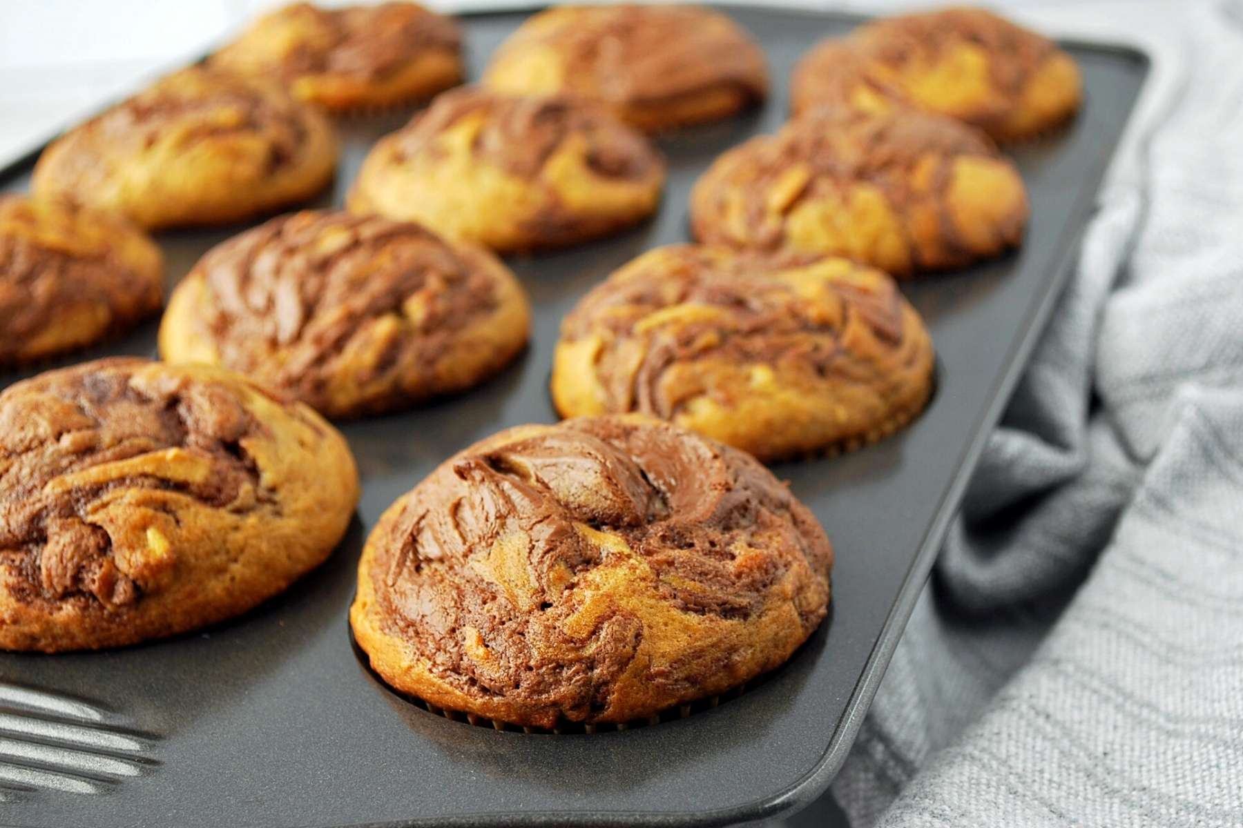 banana nutella muffins freshly baked in a muffin pan