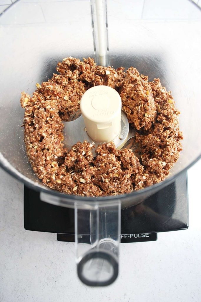 protein date ball mixture in a food processor mixed and crumbly